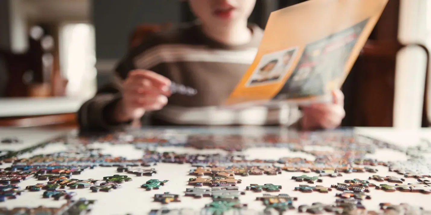 Child working a jigsaw puzzle